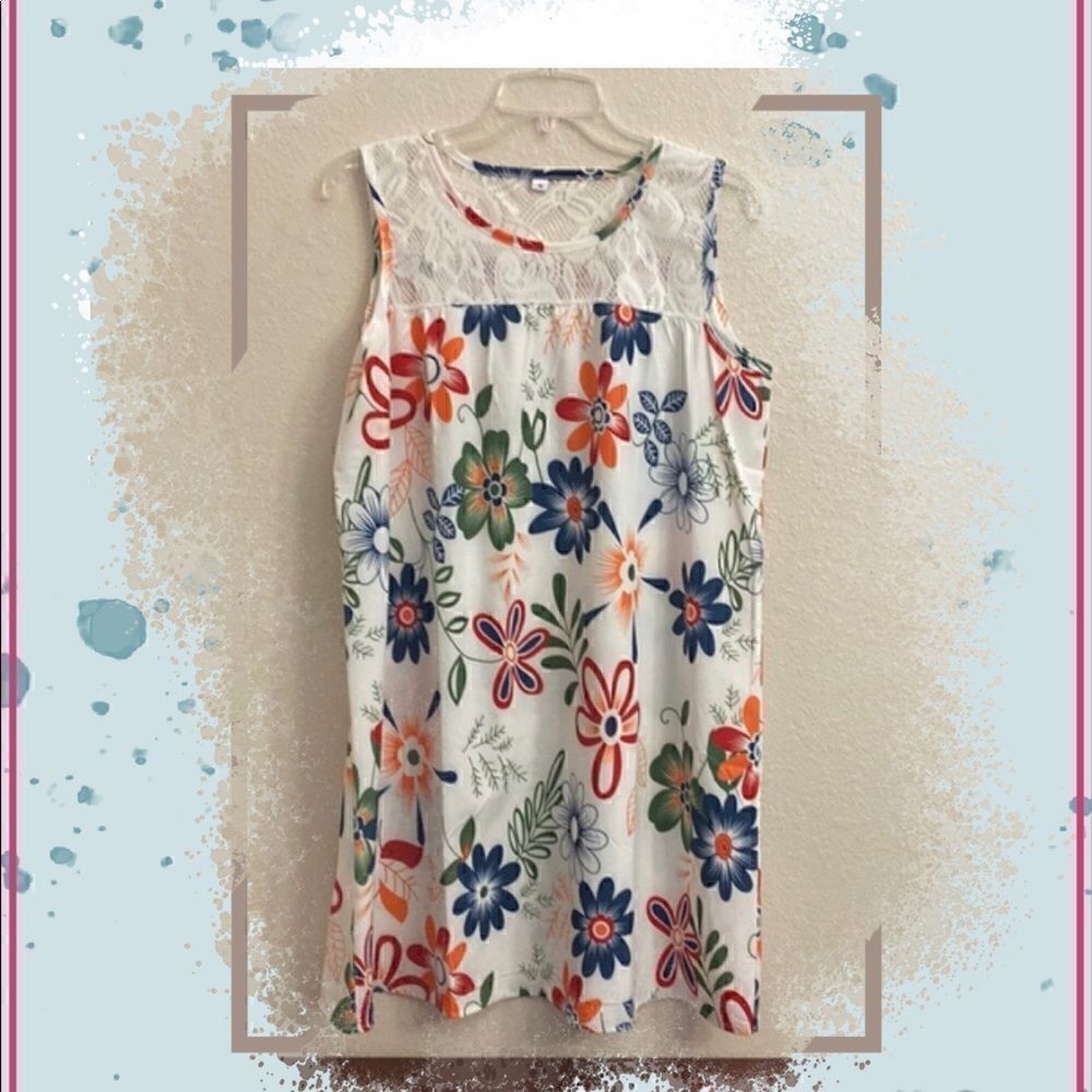 🌸🌺🌸A white dress with colorful floral design the  top and back lace design!!